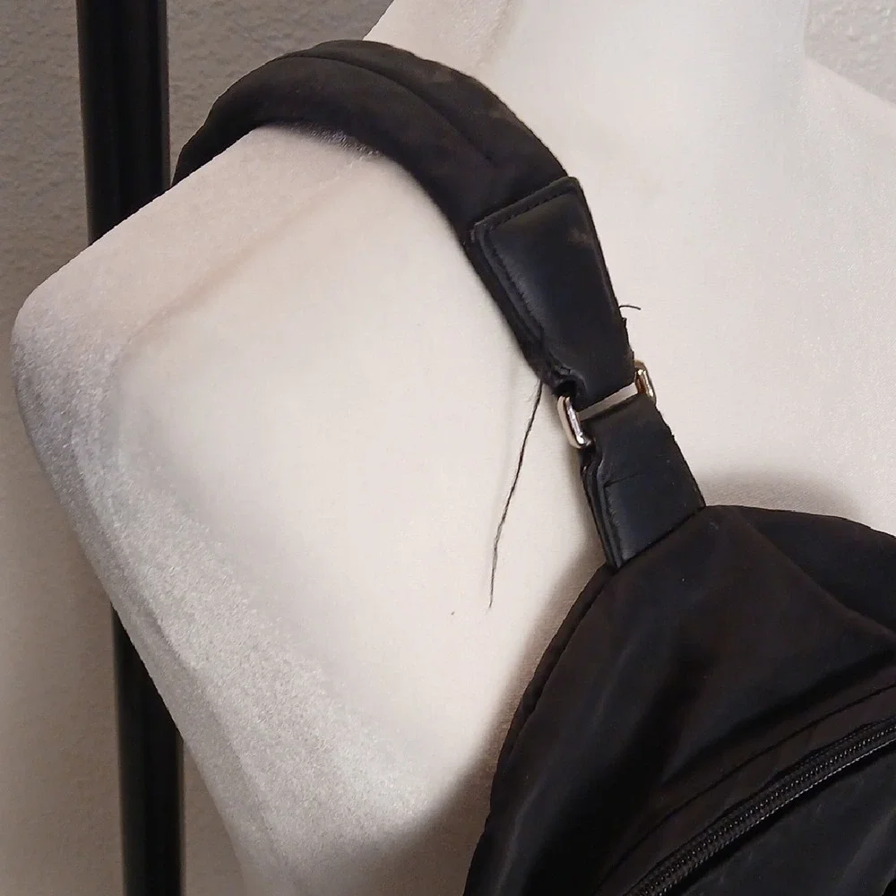 Tumi Black Belt Bag with Gold Accents